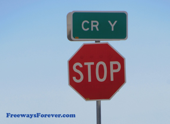 Cry sign above Stop sign (County Route "Y")