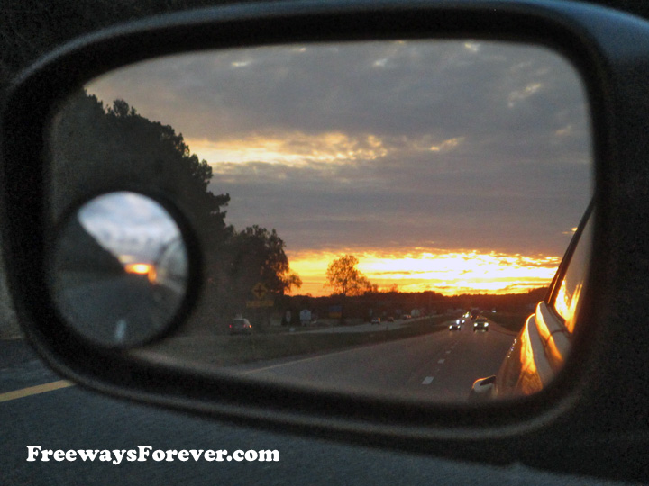 Sunset in rear-view mirror along U.S. Route 301 highway in Maryland