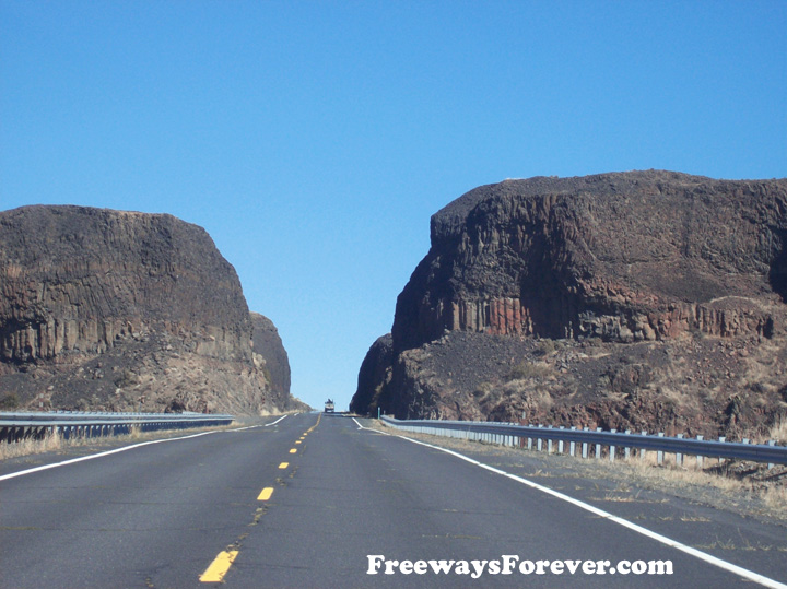 Narrow passage for highway between big rock formations on Washington State Route 155