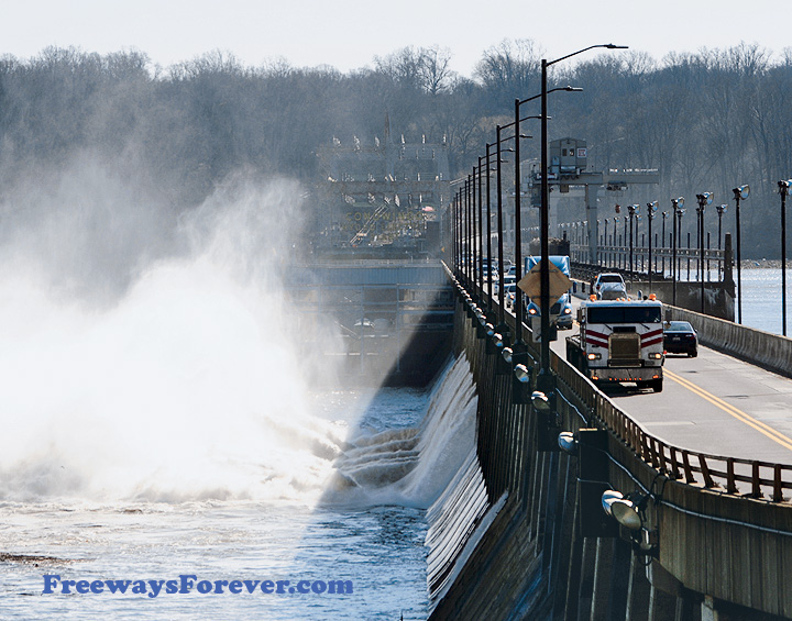 Cabover with flatbed crosses the Susquehanna River on U.S Route 1 over the Conowingo Hydroelectric Dam