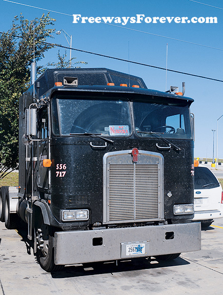 Kenworth cab over COE truck with Aerodyne sleeper at a rest stop in Nebraska